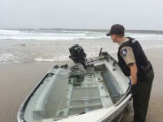 Marine Patrol officer and boat