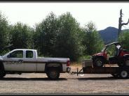 Sand Lake Patrol vehicle hauling dune buggy