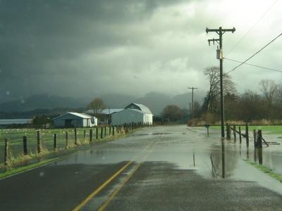 This is a photograph of Tillamook River Road being flooded.